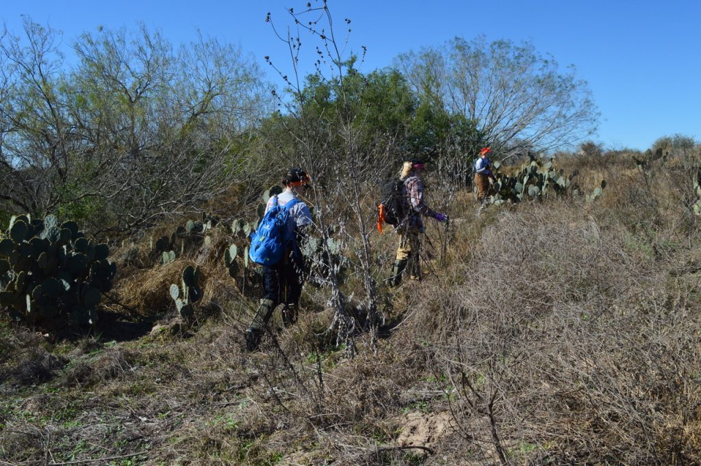 The team, in full gear, trekking through the Texas borderlands.