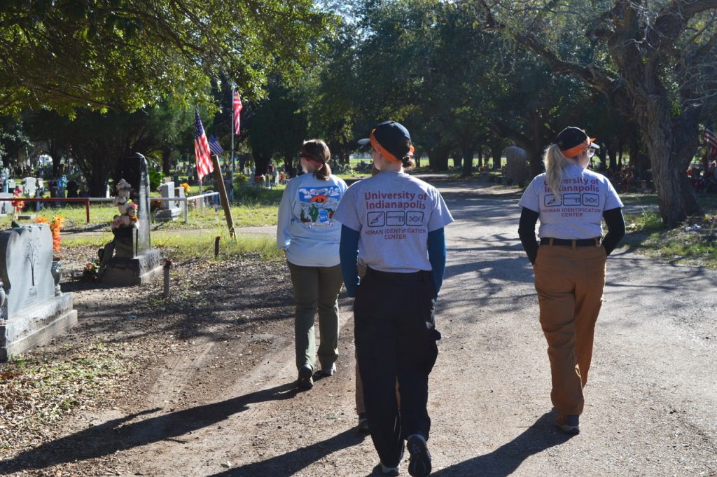 UIndy team walking through the cemetery 