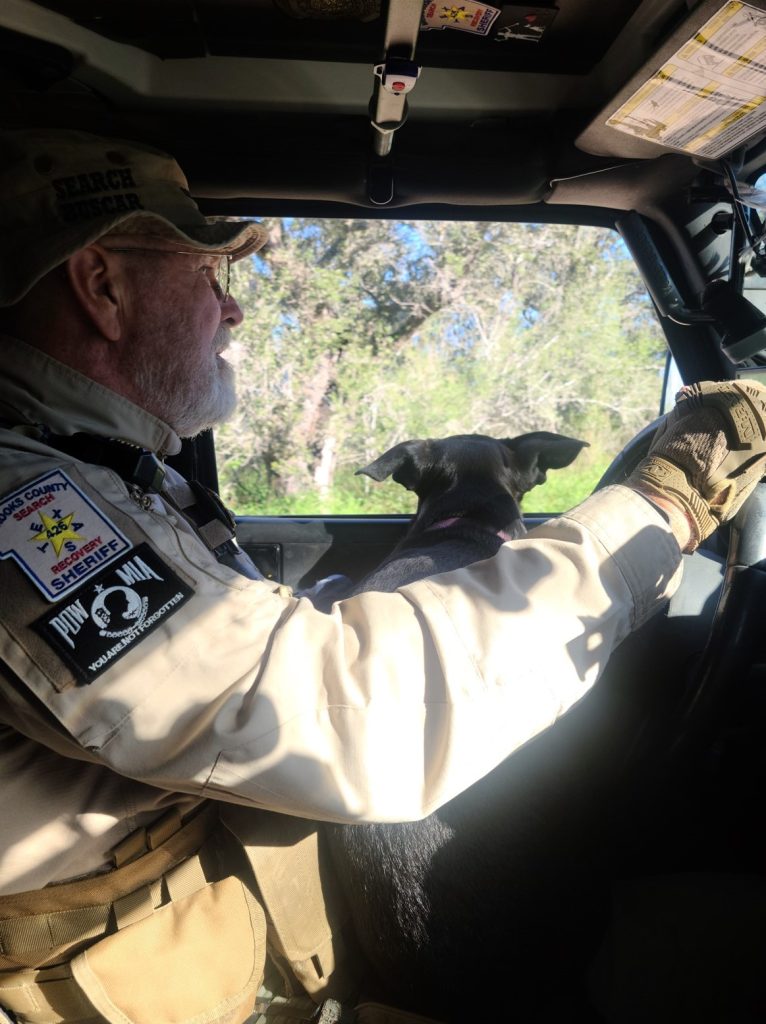 Don and Socks in the Jeep driving to the ranch.