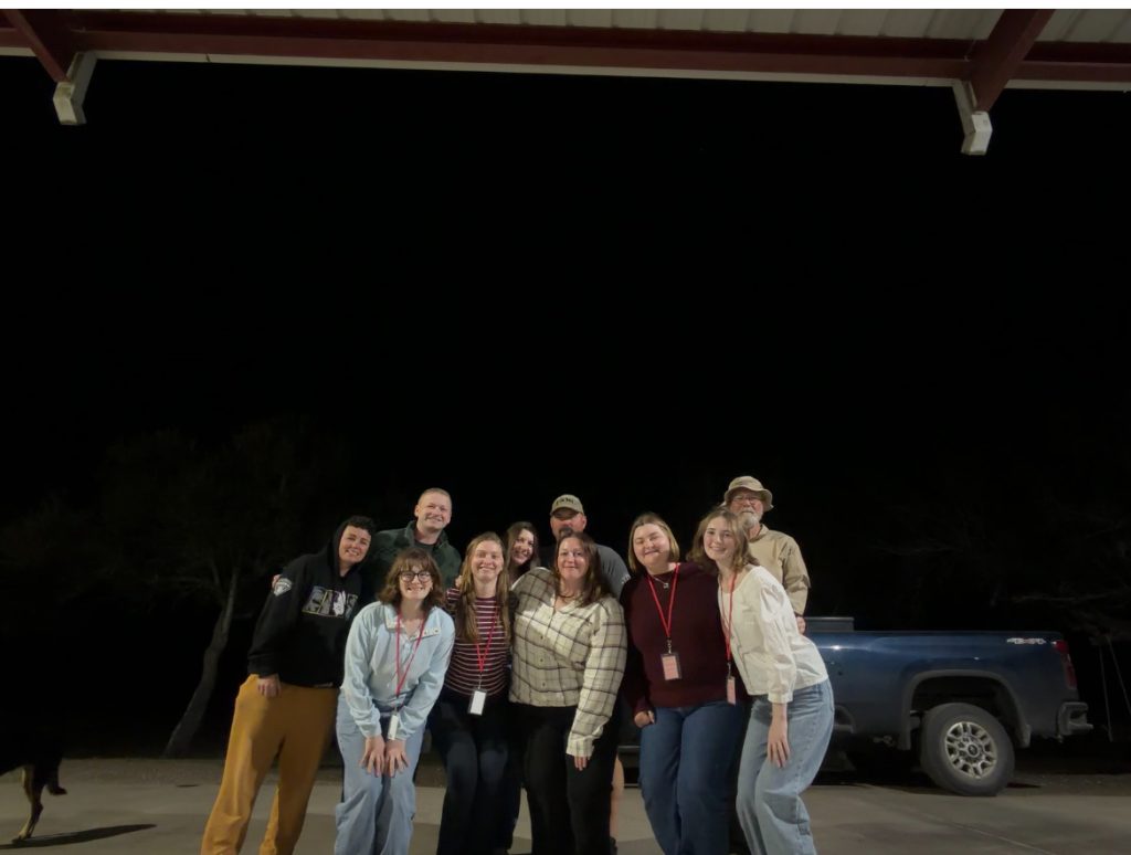 The Beyond Borders 2026 Team poses under the night sky for the last time 