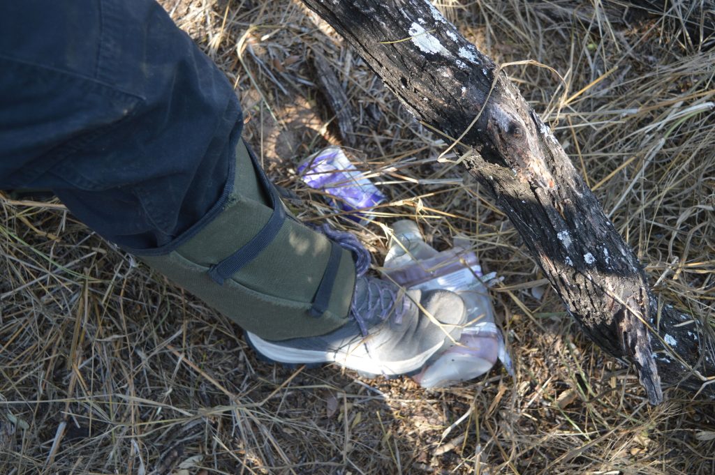 Amanda stepping on bottle to check how old it is