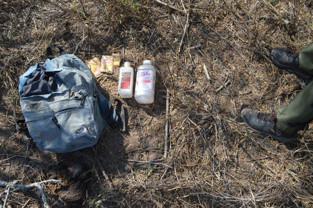 Backpack with its contents laid out