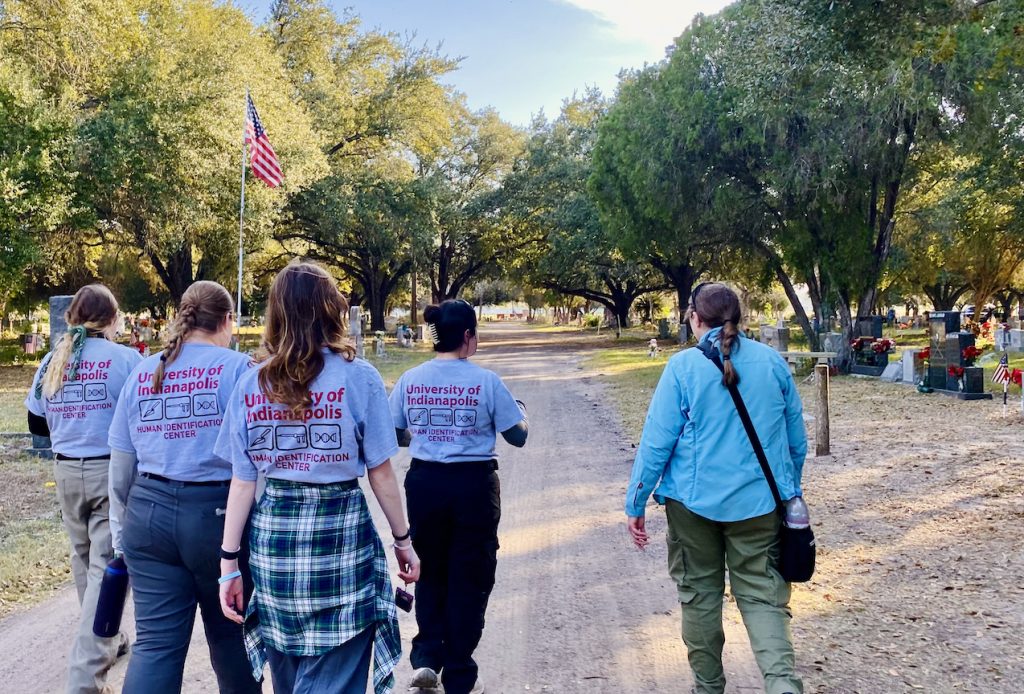 Four UIndy students take a walking tour of the Falfurrias Cemetery, guided by Dr. Krista Latham.
