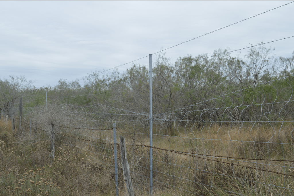 Bent fence from individuals crossing